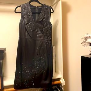 Elie Tahari black lamb leather dress with stud and flower detail. Work only once